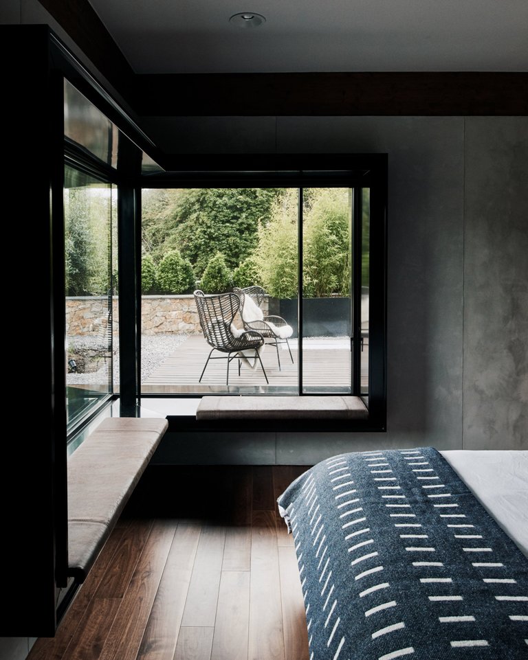 The interiors are simple and with clean lines, there are windowsill benches in the bedroom and a comfy bed plus an entry to the terrace