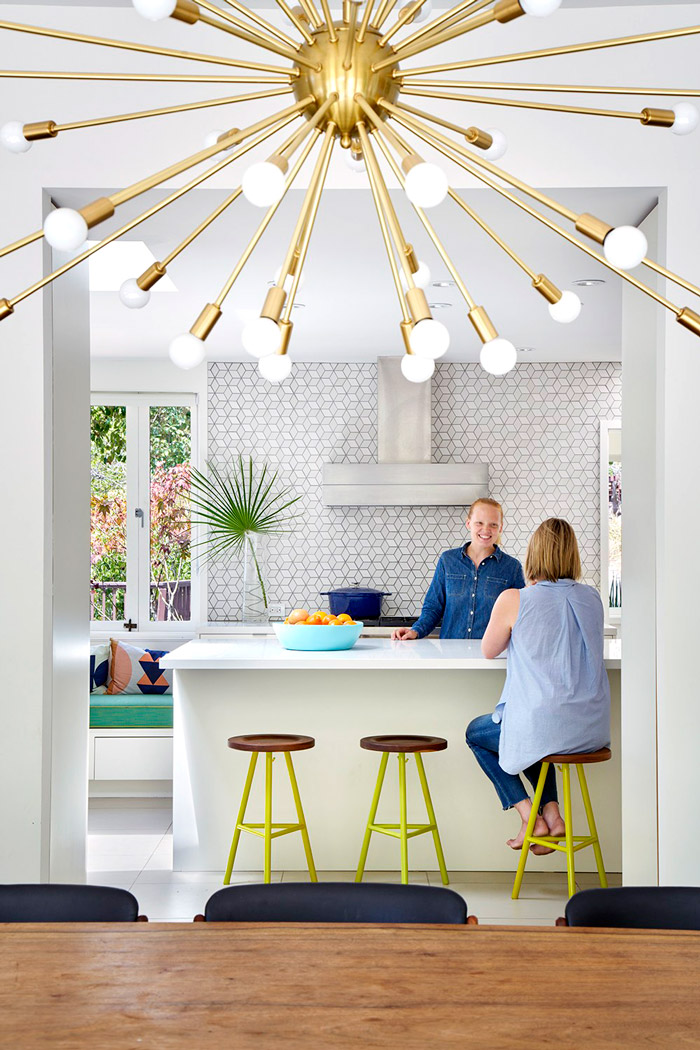 geometric tiles for a kitchen The kitchen features geometric tiles, colorful stools and is bright and open