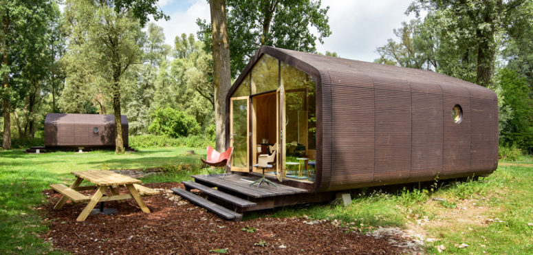 The opposite walls are glazed and there is a couple of small windows on the walls of the house