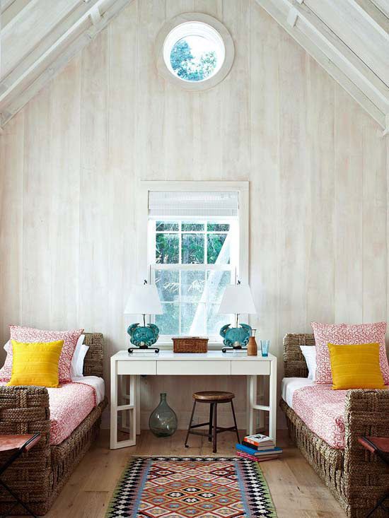 a guest bedroom with a whitewashed wooden wall and jute wrapped beds