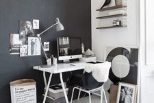 03 the home office nook is defined by a black wall and a matching chair to visually separate it