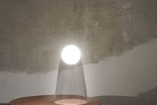 04 Satellight table lamp by Foscarini is sure to make a shining accent while having clear appearance