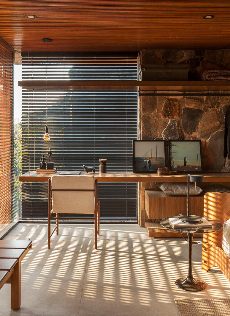 The home office is located in the bedroom, there's a wall-mounted desk next to the window