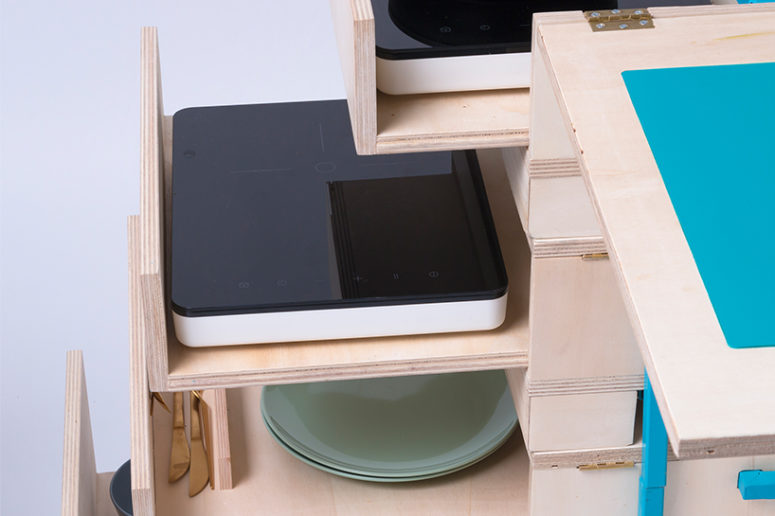 Two induction cooktops are available in drawers that include preparation space