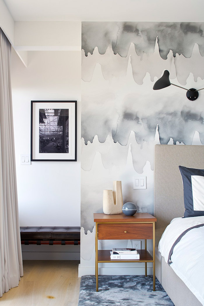 The bedroom is done with watercolor wallpaper, it's grey and blue, and looks very welcoming and soft The bedroom is done with watercolor wallpaper, it's grey and blue, and looks very welcoming and soft