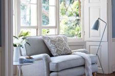 06 a corner with a comfy upholstered sofa, a side table and a matching floor lamp is a perfect reading nook