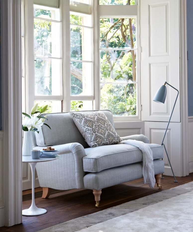 a corner with a comfy upholstered sofa, a side table and a matching floor lamp is a perfect reading nook