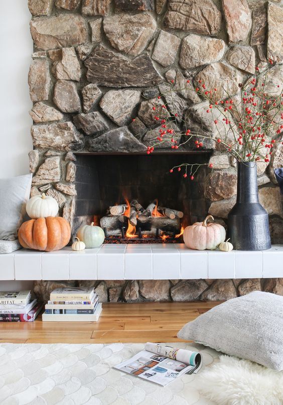 a gorgeous fireplace clad with natural stone looks cool, bold and textural and is sure to attract attention