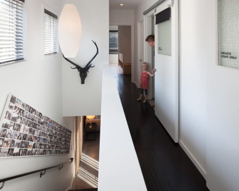 cool wall family gallery The spaces are done with lots of white to make them airy and larger, and I totally love a family photo collage, it's a modern take on a traditional photo gallery