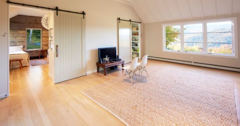 There's a comfortable space for watching TV and just inviting friends, and sliding barn doors make the space cozier yet keep it modern There's a comfortable space for watching TV and just inviting friends, and sliding barn doors make the space cozier yet keep it modern