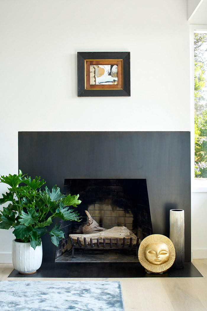living room with a dark fireplace There's a sleek dark fireplace, which isn't used but it adds coziness and comfort