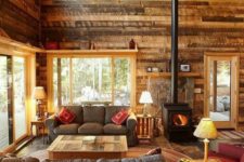 07 a cabin living room with reclaimed wooden walls and furniture for a cozy feel