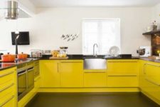 07 a modern yellow and black kitchen is sure to raise your mood with its contrasting colors