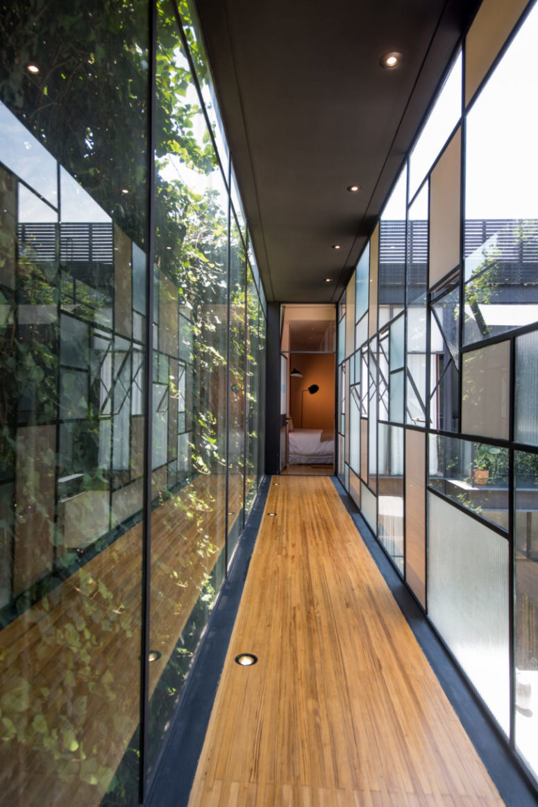 A long glazed corridor connects the guest house to the main building
