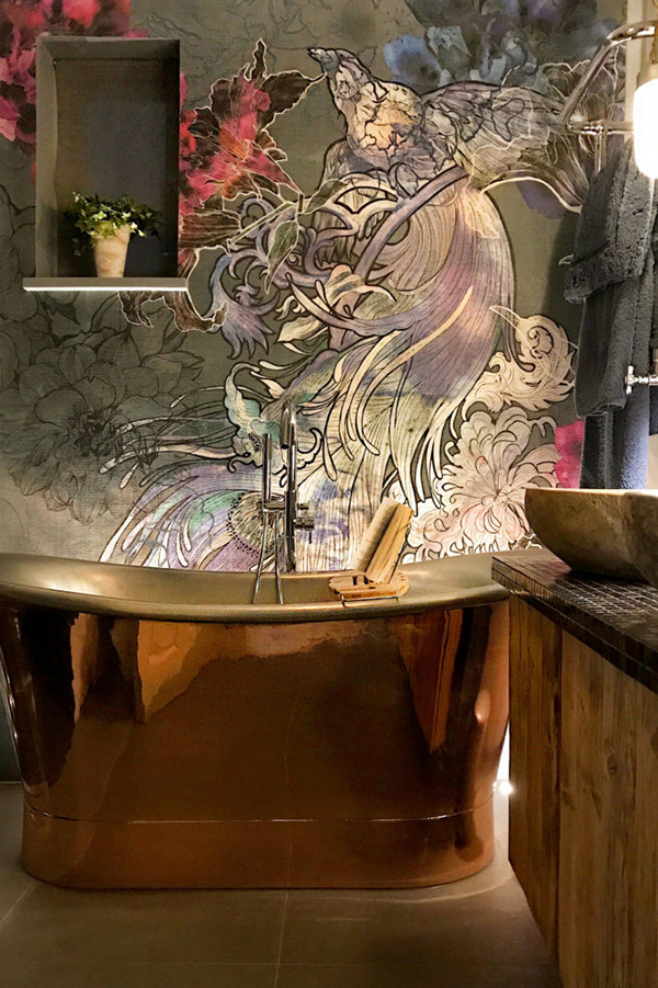 The master bathroom features a unique wall cover and a shiny metal bathtub