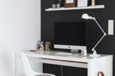 08 a minimalist home office with a statement black wall, white furniture stands out in front of this wall