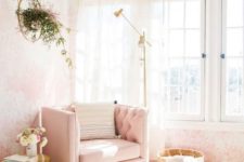 08 a nook by the wall taken by a pink chair, a floor lamp and a brass side table as a glam reading space