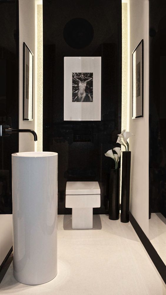 shiny black walls with white parts make the space luxurious and minimalist and bold