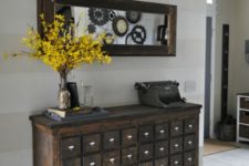09 a vintage apothecary cabinet on casters as a stunning antique entryway console