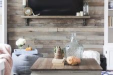 11 a cozy space with a rustic reclaimed wooden wall and a coffee table that matches