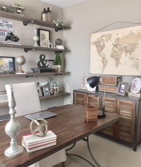 a stained wood desk on metal legs and a matching sideboard with shutters