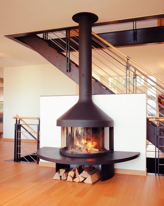 such a wood burning free-standing stove is a gorgeous idea for any modern space