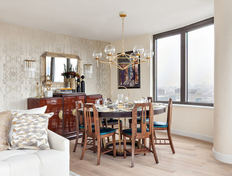 The dining space is by the window, there's a wooden dining set with teal seats and an eye-catchy cabinet