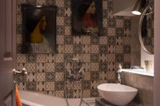 12 The second bathroom is clad with mosaic tiles and there portraits to make it artistic