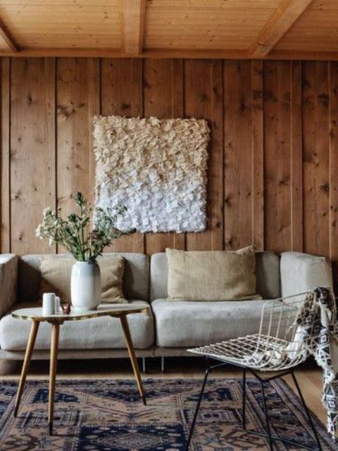 a cozy space with wooden panels and a ceiling for coziness, a fluffy artwork accentuates it