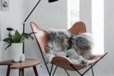 12 a stylish nook with a leather chair, a floor lamp and a side table is ideal for reading – just add pillows