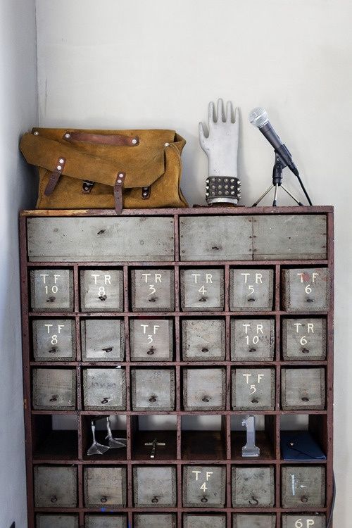 shabby chic apothecary cabinet with grey rawers as an entryway console