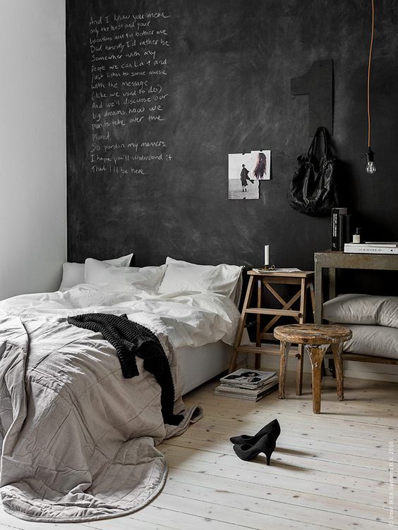 a Scandinavian space with a chalkboard headboard wall for a creative dialogue between the members of the family and some art