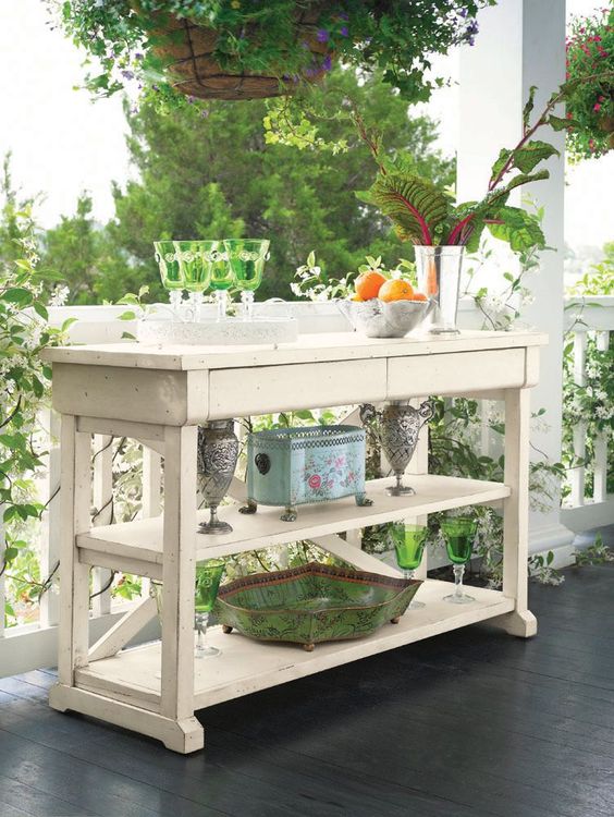a vintage kitchen island can easily become an outdoor bar with an additional storage space