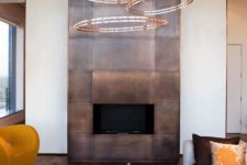 14 a modern fireplace clad with darkened copper looks really wow and impressive