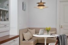 15 a cozy eating space in a small corner, a corner sofa and an eye-catchy hanging lamp over it