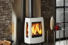15 a modern industrial interior is made cozier and more chic with a gorgeous free-standing stove with a chic design
