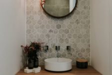 15 an accent wall with marble hexagon tiles and a wooden vanity make the space eye-catchy