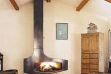 17 a vintage rustic space with a gorgeous wood burning fireplace with metal covers