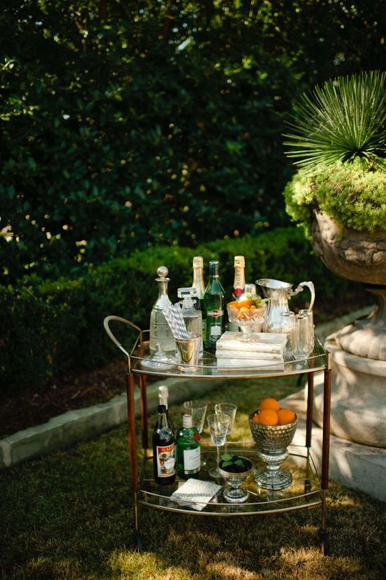a refined glass bar stand from inside can be placed outside to host a party