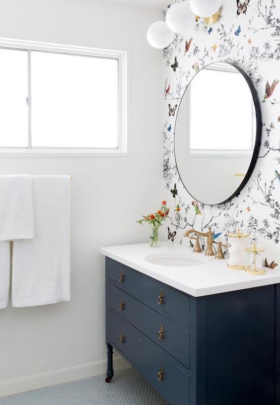 an accent wall made with butterfly print wallpaper looks super cute and sweet