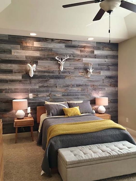 add a rustic touch to your space with a reclaimed wooden wall and faux animal heads