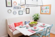 20 a colorful eclectic dining space with a comfy bench and blue chairs