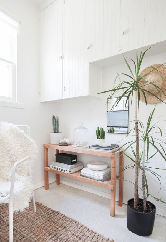 a narrow console table is a great idea for storage in an awkward nook, it fits perfectly