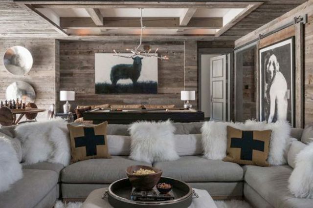 exposed wooden beams and a reclaimed wooden wall makes the space feel comfortable and rural