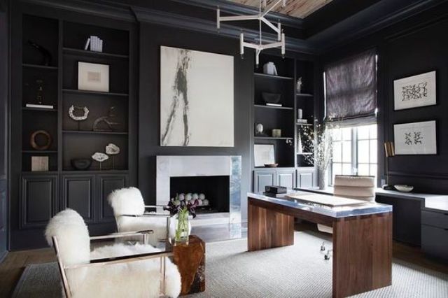 a refined home office with black walls and a white rug and furniture for a contrast looks wow