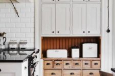 24 a wooden apothecary cabinet can stand out in a neutral kitchen