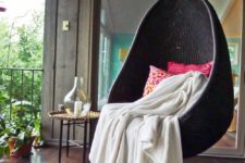 25 a stylish black egg-shaped hanging chair is a bold idea for a modern porch