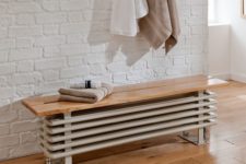 26 a radiator bench seat is a chic idea to hide it inside your bathroom and make the space usable