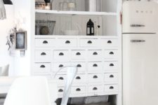 26 an apothecary cabinet painted white and turned into a comfy cupboard in the kitchen