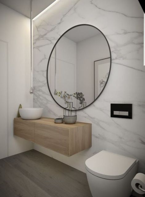 a white marble wall makes a luxurious and cool accent in the space